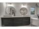 Elegant bathroom featuring a double vanity with modern fixtures and a large soaking tub at 12209 N 66Th St, Scottsdale, AZ 85254