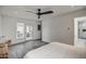 Bright bedroom featuring an ensuite bathroom and access to the backyard at 12209 N 66Th St, Scottsdale, AZ 85254