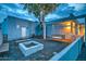 Private courtyard with a cozy swing, fire pit, and gravel ground, perfect for relaxing evenings at 12209 N 66Th St, Scottsdale, AZ 85254