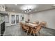 Beautifully lit dining area with fireplace and doors that open to the outdoor area at 12209 N 66Th St, Scottsdale, AZ 85254