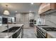 Well-appointed kitchen with updated appliances, custom cabinets, and sleek countertops for modern living at 12209 N 66Th St, Scottsdale, AZ 85254