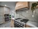 Close-up of modern kitchen with stainless steel appliances and marble backsplash at 12209 N 66Th St, Scottsdale, AZ 85254