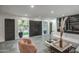 Bright living room with modern decor and oversized sliding doors leading to the outdoor space at 12209 N 66Th St, Scottsdale, AZ 85254