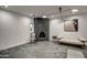 Modern living room with a sleek fireplace, minimalist furniture, stylish decor, and neutral color palette at 12209 N 66Th St, Scottsdale, AZ 85254