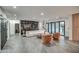 Large, open-concept living room with tile floors, modern furnishings, and patio access at 12209 N 66Th St, Scottsdale, AZ 85254