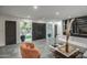 A well-lit living room with contemporary decor and open access to outdoor views at 12209 N 66Th St, Scottsdale, AZ 85254