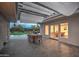 Outdoor dining area with a pergola, overlooking the pool and backyard at 12209 N 66Th St, Scottsdale, AZ 85254