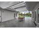 Inviting outdoor patio features a dining area, pool view, and cozy lounge setting at 12209 N 66Th St, Scottsdale, AZ 85254