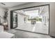 Spacious patio area with folding glass doors leading to the backyard and pool at 12209 N 66Th St, Scottsdale, AZ 85254