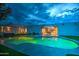 Stunning backyard pool with an outdoor seating area under the covered patio, perfect for evening relaxation at 12209 N 66Th St, Scottsdale, AZ 85254
