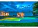 Backyard features a sparkling pool, covered patio, and well manicured lawn at 12209 N 66Th St, Scottsdale, AZ 85254