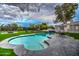 Inviting pool with a serene patio, lush lawn, and elegant landscaping for an entertainer's dream backyard at 12209 N 66Th St, Scottsdale, AZ 85254