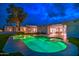 Inviting backyard pool and outdoor space illuminated at dusk at 12209 N 66Th St, Scottsdale, AZ 85254