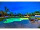 Resort-style backyard featuring a sparkling pool, outdoor kitchen, and lounge area for luxurious outdoor living at 12209 N 66Th St, Scottsdale, AZ 85254
