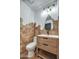 Stylish powder room features hexagon tiles, modern vanity, and a beautiful mirror at 12209 N 66Th St, Scottsdale, AZ 85254