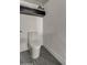 Sleek and modern toilet with a clean design, complemented by a decorative shelf above at 12209 N 66Th St, Scottsdale, AZ 85254