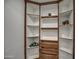 Well-organized walk-in closet with custom shelving, drawers, and ample storage space at 12209 N 66Th St, Scottsdale, AZ 85254