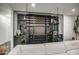 Climate-controlled wine room with glass enclosure and custom shelving for wine storage and display at 12209 N 66Th St, Scottsdale, AZ 85254