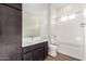 Bright bathroom features modern fixtures, a sleek vanity, and a bathtub-shower combination for relaxation at 13653 W Crabapple Dr, Peoria, AZ 85383