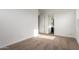 Bright bedroom features a neutral carpet, white trim, and view of a bathroom at 13653 W Crabapple Dr, Peoria, AZ 85383