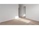 A bedroom offers neutral carpet, white walls, and multiple doors for closet and ensuite access at 13653 W Crabapple Dr, Peoria, AZ 85383