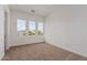 Bedroom features three large windows and neutral carpet, offering a bright and comfortable space at 13653 W Crabapple Dr, Peoria, AZ 85383