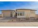 Beautiful home featuring desert landscaping, a modern garage door, and stucco accents at 13653 W Crabapple Dr, Peoria, AZ 85383