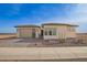 Charming single-story home featuring a well-manicured front yard and a two-car garage at 13653 W Crabapple Dr, Peoria, AZ 85383
