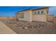 Well-kept landscaping with a modern exterior at 13653 W Crabapple Dr, Peoria, AZ 85383