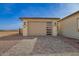 Detached one-car garage with an attractive overhead door and a paved driveway at 13653 W Crabapple Dr, Peoria, AZ 85383
