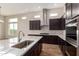 Bright kitchen featuring an island, stainless steel appliances, light countertops, and modern fixtures at 13653 W Crabapple Dr, Peoria, AZ 85383