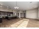 Bright living space featuring hardwood floors, recessed lighting, and seamless flow into the kitchen at 13653 W Crabapple Dr, Peoria, AZ 85383