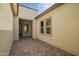 Covered patio with decorative paving and access to the main house at 13653 W Crabapple Dr, Peoria, AZ 85383