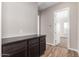 Room features a cabinet with drawers and a countertop, with a door leading to a carpeted room at 13653 W Crabapple Dr, Peoria, AZ 85383