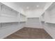 Spacious walk-in closet features carpet floors and multiple shelves for maximum storage at 13653 W Crabapple Dr, Peoria, AZ 85383