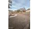 Backyard showcases desert landscaping, shed, and privacy wall at 15659 W Ripple Cir, Goodyear, AZ 85338