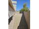 Spacious backyard featuring gravel landscaping and a covered patio, offering ample space for outdoor enjoyment at 15659 W Ripple Cir, Goodyear, AZ 85338