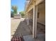Covered patio perfect for outdoor living with a shed and gravel landscaping for low maintenance at 15659 W Ripple Cir, Goodyear, AZ 85338