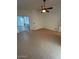Bedroom featuring tiled floors, recessed lighting, and a sliding glass door at 15659 W Ripple Cir, Goodyear, AZ 85338