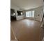 Spacious living room has tile flooring and bright windows at 15659 W Ripple Cir, Goodyear, AZ 85338