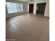 Living area featuring tile flooring and natural light at 15659 W Ripple Cir, Goodyear, AZ 85338