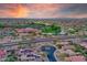 Stunning aerial view showcasing lush landscaping, water features, and desert beauty at 15848 W Lahlum Ln, Surprise, AZ 85374
