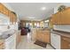 Open kitchen with a sink overlooking the living room, perfect for entertaining and interacting with guests at 15848 W Lahlum Ln, Surprise, AZ 85374
