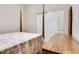 Bedroom featuring neutral walls, a quilted bedspread, and a wooden dresser at 16026 N 171St Ln, Surprise, AZ 85388