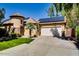 Inviting single-story home with desert landscaping, a two car garage, and a tile roof at 16026 N 171St Ln, Surprise, AZ 85388