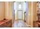 Inviting hallway with light walls, wooden accents, and stylish tiled flooring at 16026 N 171St Ln, Surprise, AZ 85388
