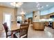 Open concept dining area showcasing kitchen with center island and stainless appliances at 16026 N 171St Ln, Surprise, AZ 85388