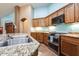 Modern kitchen featuring stainless steel appliances, granite countertops, and custom cabinetry at 16026 N 171St Ln, Surprise, AZ 85388