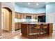 Spacious kitchen with granite countertops, stainless steel appliances, and breakfast bar at 16026 N 171St Ln, Surprise, AZ 85388
