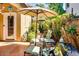 Private patio area with an umbrella, seating, and a grill for outdoor enjoyment at 16026 N 171St Ln, Surprise, AZ 85388